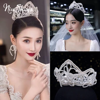 NiuShuya אופנה לבן פנינה כלה לשיער הכתר בעבודת יד תכשיטי חתונה שיער הכתר נשים אביזרים ראש